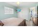 Bright bedroom featuring a large window, closet, and an ensuite bathroom for convenience at 7 Braden Castle Dr, Bradenton, FL 34208