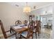 Ornate chandelier above the formal dining room, adjacent to the bright and open living area at 7 Braden Castle Dr, Bradenton, FL 34208