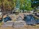 Scenic view of historical ruins surrounded by lush greenery and a partial view of waterfront homes at 7 Braden Castle Dr, Bradenton, FL 34208