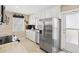 Functional kitchen featuring stainless steel appliances, granite countertops and white cabinetry at 7 Braden Castle Dr, Bradenton, FL 34208
