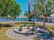 Beautiful waterfront memorial featuring patriotic symbols, lush landscaping, and scenic water views at 7 Braden Castle Dr, Bradenton, FL 34208