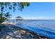 Extensive pier with a covered gazebo extends into the tranquil waters, offering stunning views and a peaceful escape at 7 Braden Castle Dr, Bradenton, FL 34208
