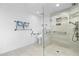 Modern bathroom featuring sleek tile flooring and walls and a glass enclosed walk in shower at 71 Tidy Island Blvd, Bradenton, FL 34210