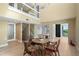 Dining area with high ceilings, view of the waterfront, and access to other rooms at 71 Tidy Island Blvd, Bradenton, FL 34210