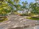 Circular driveway lined with trees and lush landscaping leading to the home at 71 Tidy Island Blvd, Bradenton, FL 34210