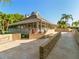 A beautiful clubhouse with a cozy porch, brick terrace, and stunning landscape creates a relaxing atmosphere at 71 Tidy Island Blvd, Bradenton, FL 34210