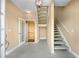 Inviting foyer featuring tile floors, staircase and a rare residential elevator to all floors at 71 Tidy Island Blvd, Bradenton, FL 34210