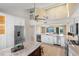 Open kitchen with island, stainless steel appliances, adjacent living area, and waterfront views at 71 Tidy Island Blvd, Bradenton, FL 34210