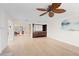Open living space leading to kitchen and dining areas, with hardwood floors and ample natural light at 71 Tidy Island Blvd, Bradenton, FL 34210
