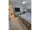 Neutral bedroom with modern furnishings, ensuite bathroom, and tiled floors at 7520 4Th W Ave # 1, Bradenton, FL 34209