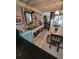 Dining room has a small fridge, unique spiral staircase, and decorations at 7520 4Th W Ave # 1, Bradenton, FL 34209