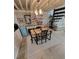 Dining room features a wooden table, decorative furniture, and a spiral staircase at 7520 4Th W Ave # 1, Bradenton, FL 34209