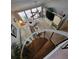 Lofted living room featuring spiral staircase, modern decor, and tons of natural light at 7520 4Th W Ave # 1, Bradenton, FL 34209