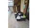 Comfortable patio with tiled flooring and wicker furniture, perfect for outdoor lounging and enjoying the view at 7520 4Th W Ave # 1, Bradenton, FL 34209