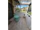 Enclosed patio with tile flooring and seating, offering a peaceful outdoor relaxation area at 7520 4Th W Ave # 1, Bradenton, FL 34209