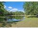 Scenic pond surrounded by lush greenery at 7618 Broomsedge Ct, Lakewood Ranch, FL 34202