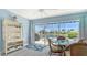 Inviting dining area with lovely views of the pool, backyard, and waterfront at 7664 Camminare Dr, Sarasota, FL 34238