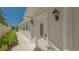 Front exterior view with decorative front door, walkway and shrubbery at 7664 Camminare Dr, Sarasota, FL 34238