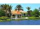 Picturesque gazebo overlooking the lake, ideal for relaxing and enjoying the beautiful scenery at 7664 Camminare Dr, Sarasota, FL 34238