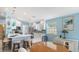 Bright open kitchen featuring modern appliances, breakfast bar, and eat-in dining area at 7664 Camminare Dr, Sarasota, FL 34238