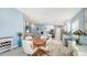 Open-concept living space with dining area and modern kitchen at 7664 Camminare Dr, Sarasota, FL 34238