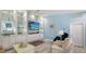 Cozy living room with bright decor and a view into the modern kitchen at 7664 Camminare Dr, Sarasota, FL 34238