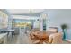 Bright living room featuring access to the backyard and pool, with comfortable seating at 7664 Camminare Dr, Sarasota, FL 34238