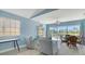 Beautiful living room area featuring access to an outdoor pool at 7664 Camminare Dr, Sarasota, FL 34238