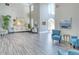 Welcoming lobby with high ceilings, stylish furnishings, and an abundance of natural light at 7664 Camminare Dr, Sarasota, FL 34238