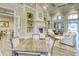 Inviting lounge area with a cozy fireplace, stylish decor, and comfortable seating arrangement at 7664 Camminare Dr, Sarasota, FL 34238