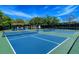 Vibrant blue and green pickleball courts offering a great space for community recreation and exercise at 7664 Camminare Dr, Sarasota, FL 34238