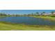 Scenic view of a serene pond surrounded by lush greenery, offering a tranquil escape and natural beauty at 7664 Camminare Dr, Sarasota, FL 34238