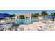 Resort-style pool with comfortable lounge chairs and shaded umbrellas for relaxation at 7664 Camminare Dr, Sarasota, FL 34238