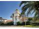 Stunning Town Center features clock tower, elegant architecture, and lush landscaping at 7664 Camminare Dr, Sarasota, FL 34238