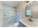 Beautiful bathroom featuring a glass shower, decorative tile, and modern vanity at 826 Lillian Ln, Sarasota, FL 34243