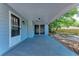 Exterior side door entrance with neutral siding and covered porch at 826 Lillian Ln, Sarasota, FL 34243