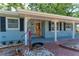 A charming single-story home with a covered entryway and brick path at 826 Lillian Ln, Sarasota, FL 34243