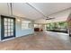 Covered lanai with stamped concrete flooring and fan at 826 Lillian Ln, Sarasota, FL 34243