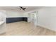 Spacious living room boasts modern flooring, neutral paint, and ample natural light at 826 Lillian Ln, Sarasota, FL 34243