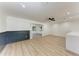 Spacious living room boasts modern flooring, neutral paint, and ample natural light at 826 Lillian Ln, Sarasota, FL 34243