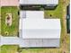 An aerial view of a well-maintained single-story home with a metal roof and manicured landscaping at 8534 Imperial Cir, Palmetto, FL 34221