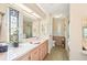 Bathroom featuring a long vanity, decorative glass, and a separate toilet and shower area at 8534 Imperial Cir, Palmetto, FL 34221