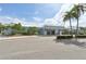 Exterior view of the community center with ample parking and landscaped grounds under a clear sky at 8534 Imperial Cir, Palmetto, FL 34221