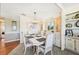 Dining area with seating for six, pendant lighting, and ample cabinet space at 8534 Imperial Cir, Palmetto, FL 34221