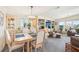 Elegant dining room featuring a chandelier, seating for six, and built in cabinets at 8534 Imperial Cir, Palmetto, FL 34221