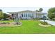 Inviting single-story home boasts beautifully landscaped front yard and convenient covered parking at 8534 Imperial Cir, Palmetto, FL 34221