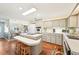 Bright kitchen featuring an island cooktop, white appliances, and ample counter space at 8534 Imperial Cir, Palmetto, FL 34221
