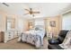 Bright main bedroom featuring a dresser, nightstands, and a large window at 8534 Imperial Cir, Palmetto, FL 34221
