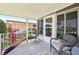 Cozy porch area with comfortable seating, perfect for enjoying the outdoors and neighborhood views at 8534 Imperial Cir, Palmetto, FL 34221
