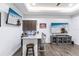 Finished basement with modern bar, stylish cabinets, and entertainment area with sleek console at 1007 143Rd Ne St, Bradenton, FL 34212